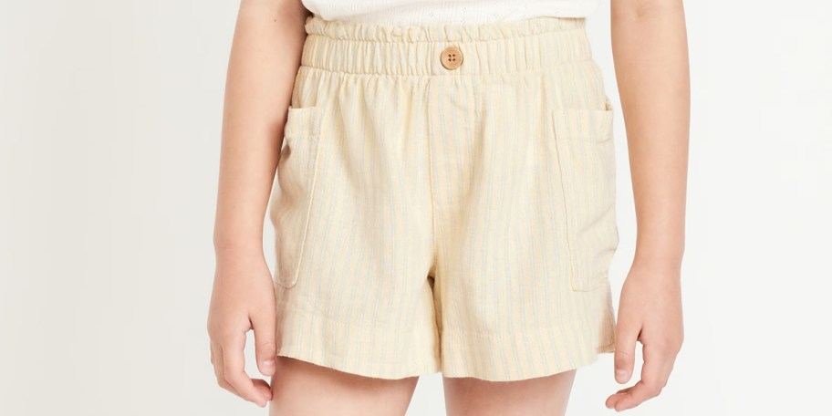 girl wearing biege shorts