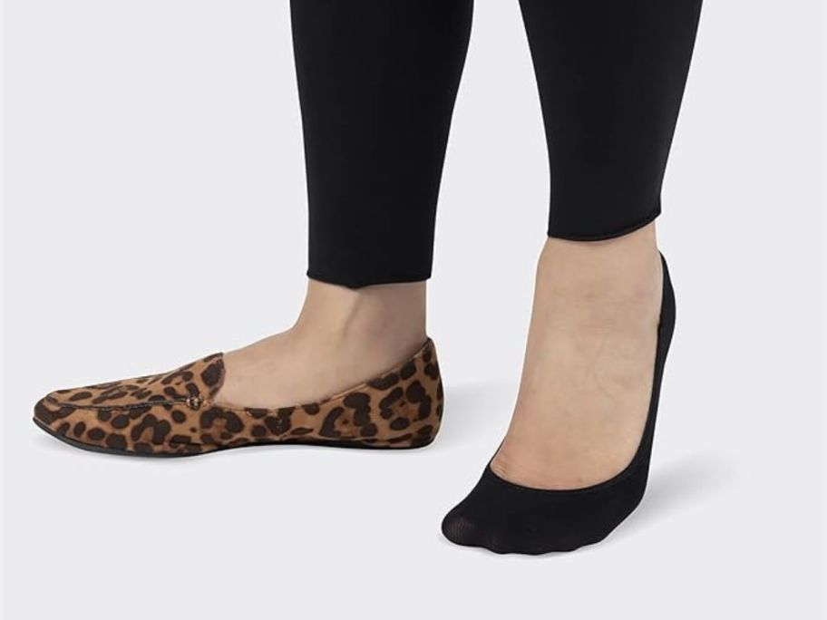 woman wearing Peds Women's Lightweight Low Cut No Show Sock on one foot and a shoe on another