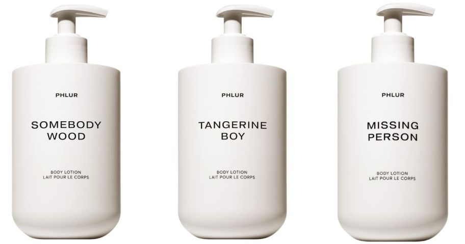 three PHLUR Somebody Wood Body Lotion bottles