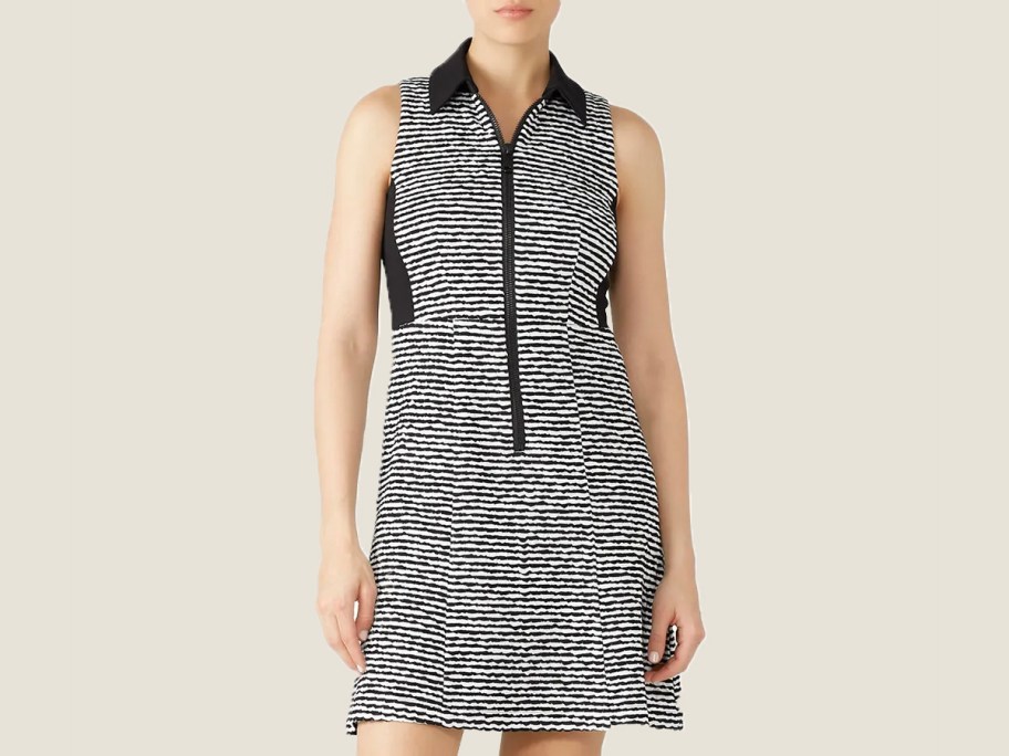 woman wearing black and white striped polo dress 