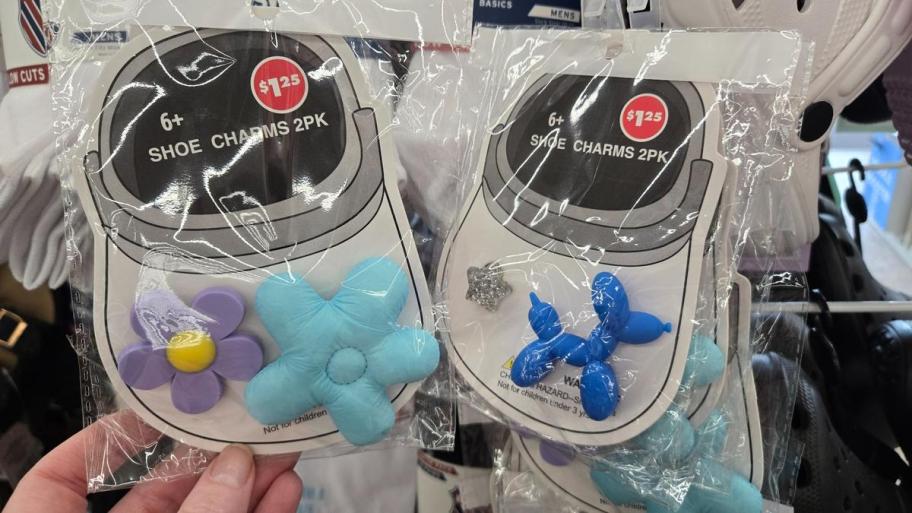 Two packs of novelty shoe charms including a balloon dog, flower, star, and puffy flower shapes.