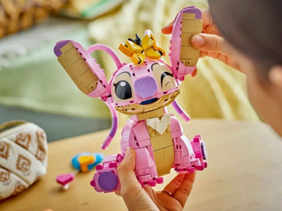 girl holding LEGO Disney Angel Lilo & Stitch Kids Building Toy