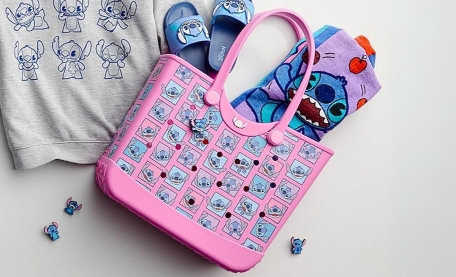 a pink eva stitch tote with a stitch beach towel and flip flops poking out the top