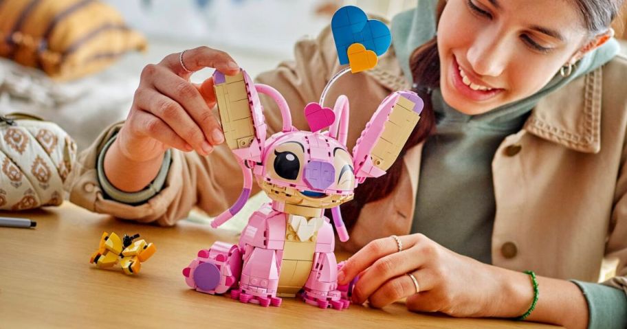 girl playing with LEGO Disney Angel Lilo & Stitch Kids Building Toy