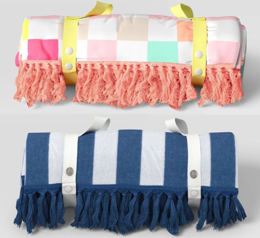 2 rolled beach blankets in a stripe and a check