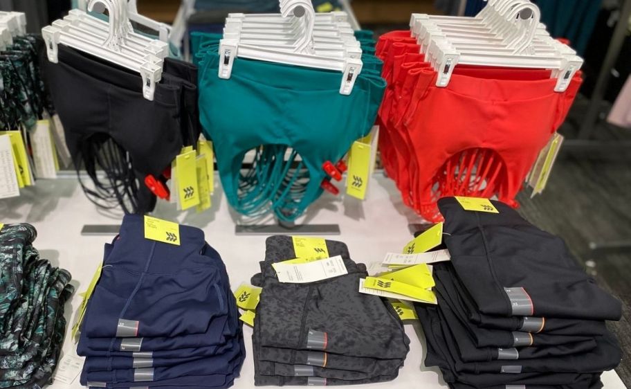 sports bras and leggings on a tabletop store display