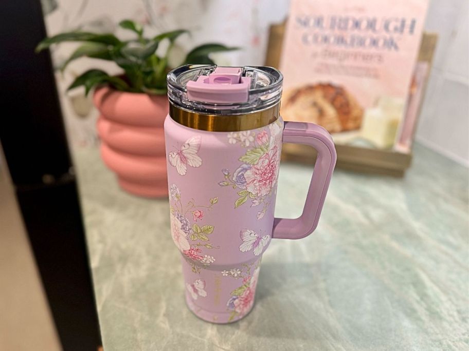 purple floral tumbler on counter