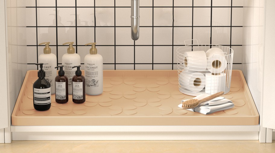 under sink mat with haircare items on top