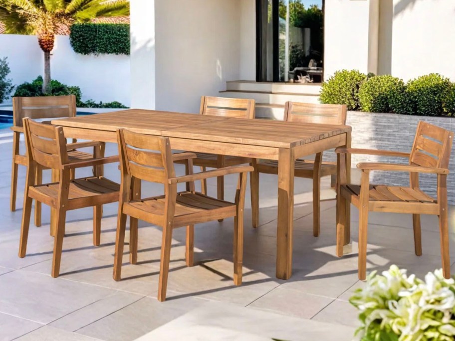 teak dining table and 6 chairs on patio 