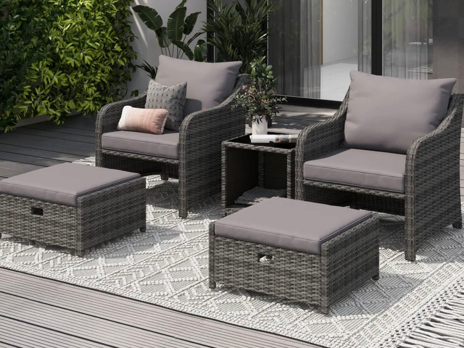 black and gray patio chairs and table outdoors 