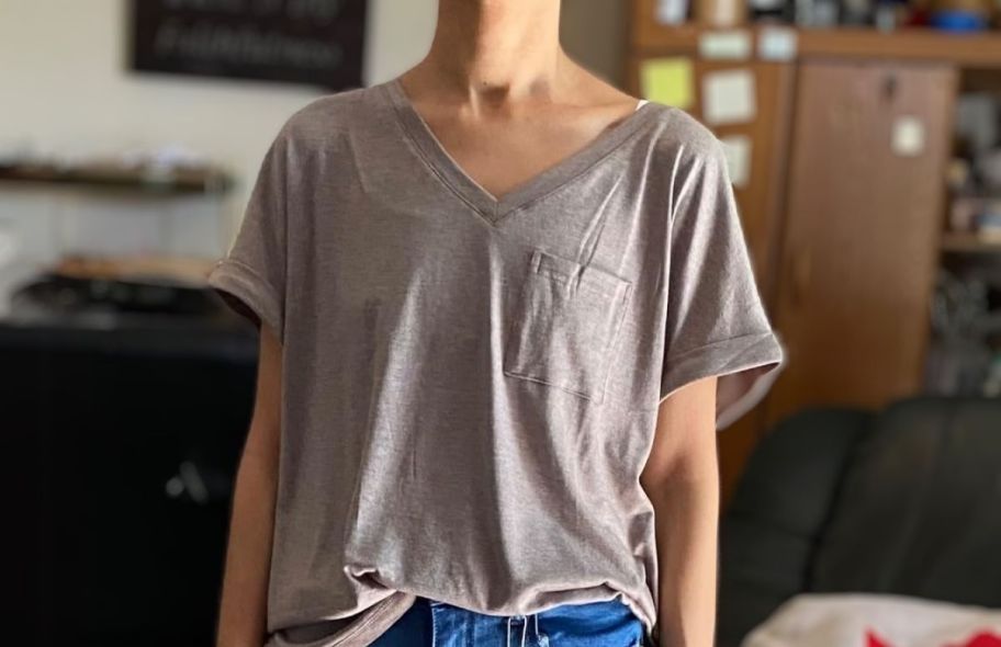 a woman in a coffee gray v neck pocket tee
