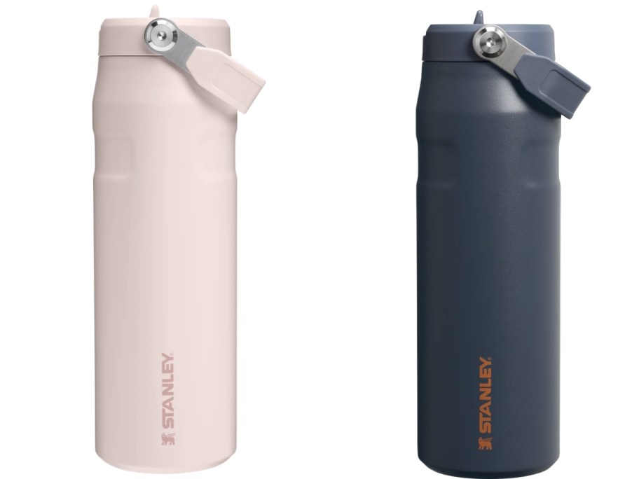 2 Stanley water bottles, one light pink, the other dark navy with orange