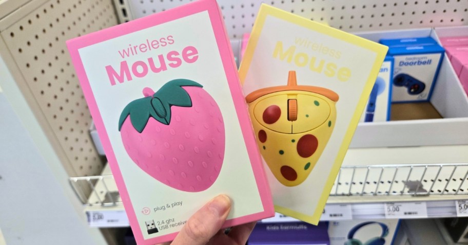 hand holding 2 boxes of novelty computer mice that look like a strawberry and pizza slice
