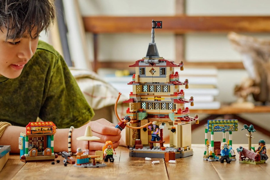 LEGO temple with minifigures battling out front