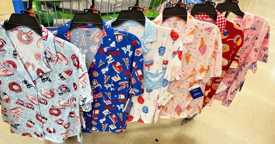 summer-themed pajama sets hanging from shopping cart