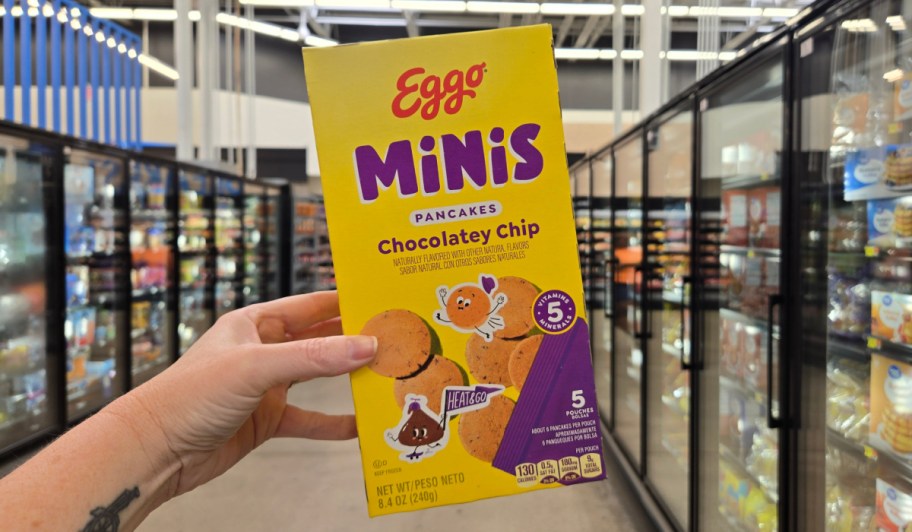 hand holding chocolate chip mini pancakes box in store 