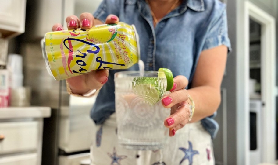 woman pouring a sparkling water